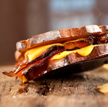 Load image into Gallery viewer, Nueske&#39;s Pepper Coated Bacon 8oz
